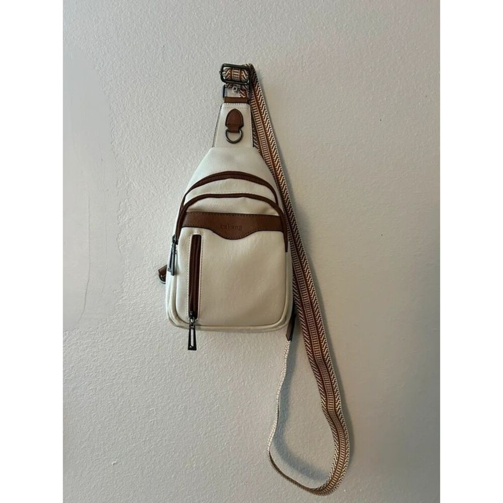 Cream and brown crossbody saddle bag